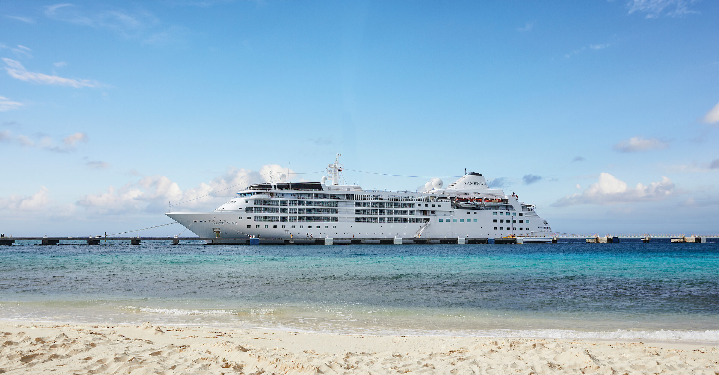 Silver Wind anchored nearby a beach.